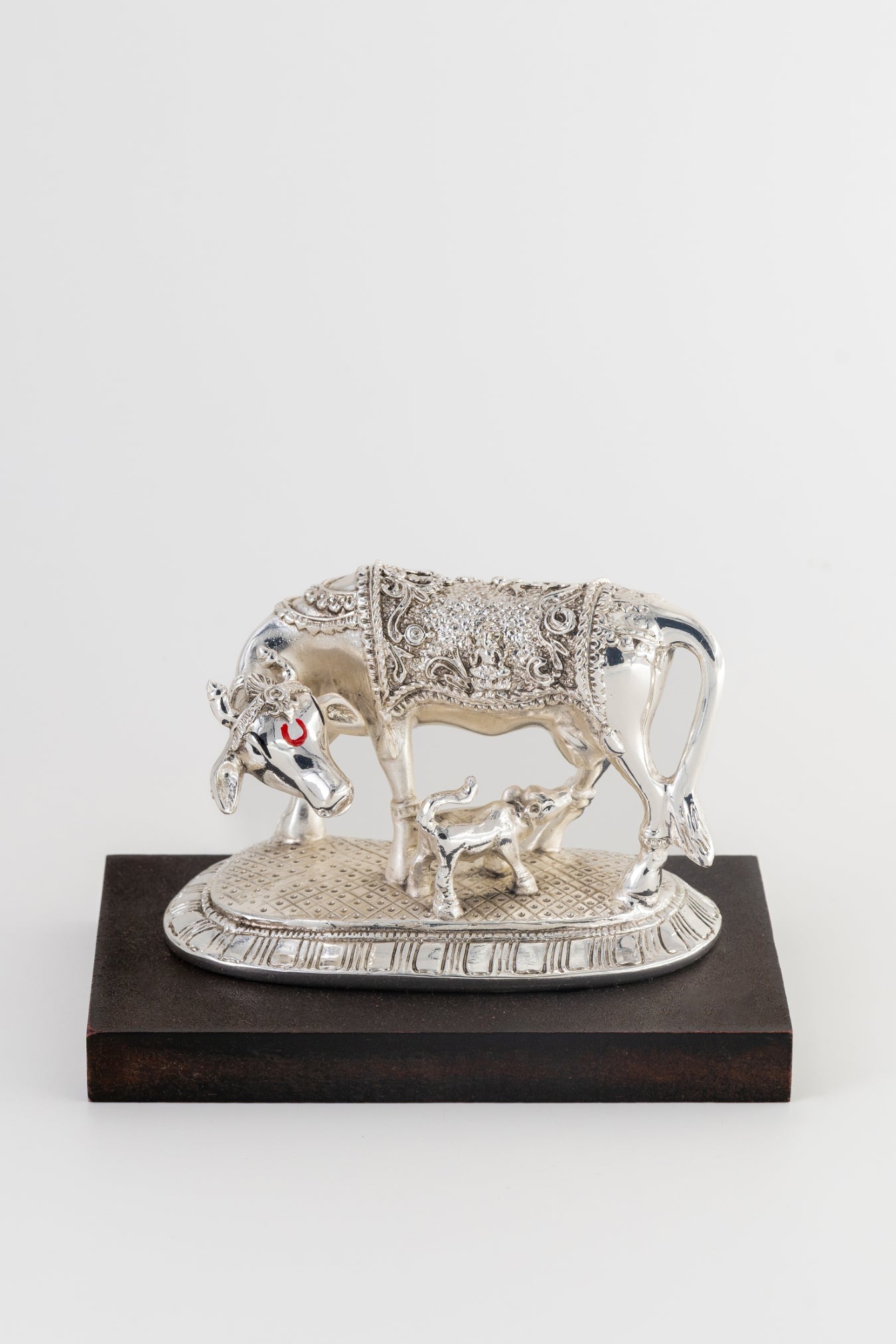 Silver-Foiled Kamdhenu Cow & Calf Figurine on Wooden Base – 5in × 7in